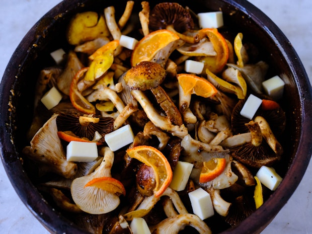 Marinated mushrooms before baking in a baking dish