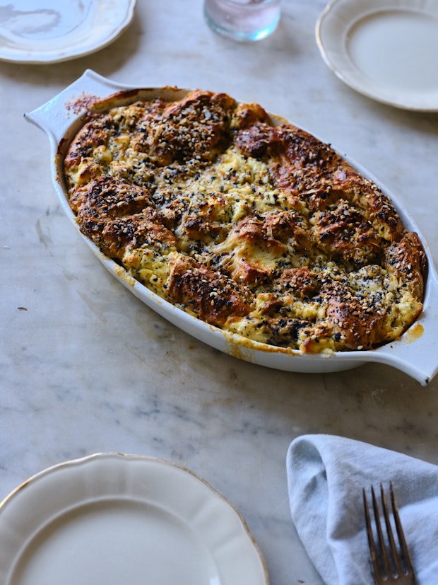 Just baked breakfast casserole surrounded by three plates