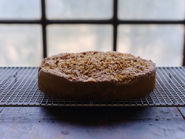 Walnut Nutmeg Butter Cake Cooling on Rack near Window