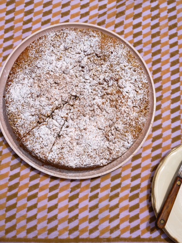 Slicing Walnut Nutmeg Butter Cake on PLatter