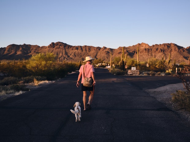 Wayne and Polly on a Walk with Mountains in Background at Sunset