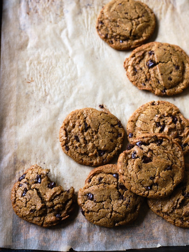 Chickpea Chocolate Chip Cookies on a Parchment-lined Baking Sheet