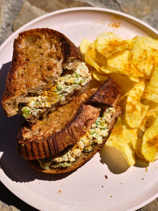 Cross-section View of Chickpea Salad Sandwich on a Plate cut in Half