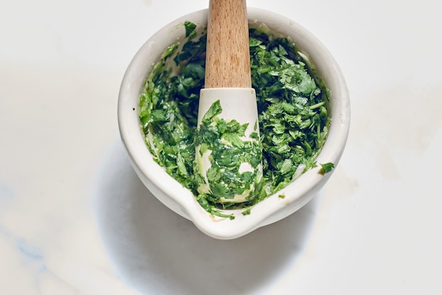 Coconut Sauce Ingredients Being Crushed in Mortar and Pestle