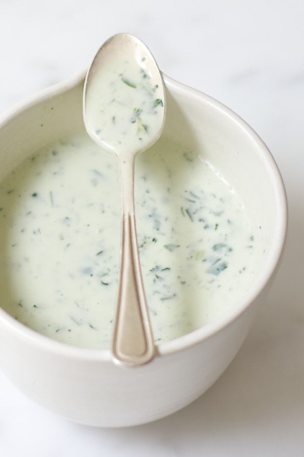 Lemon Coconut Sauce in a Serving Bowl with a Spoon