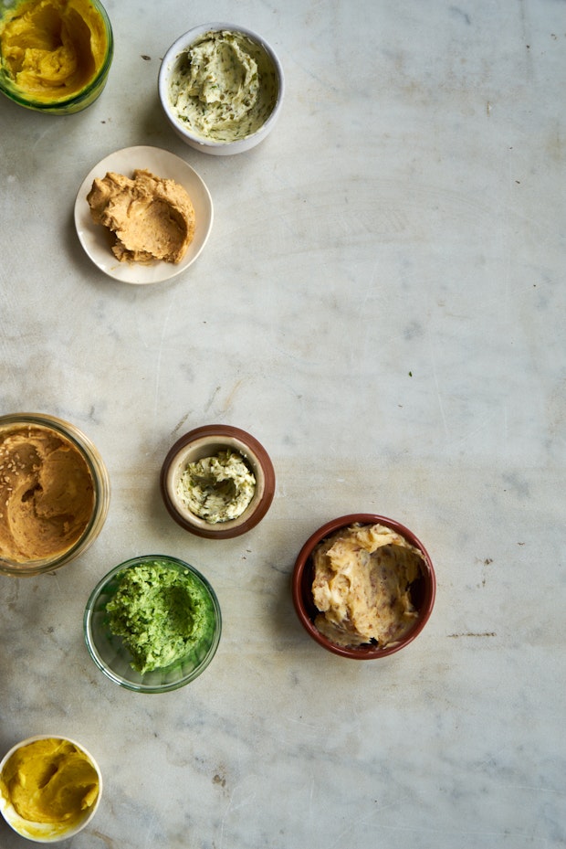 An assortment of compound butters on a counter