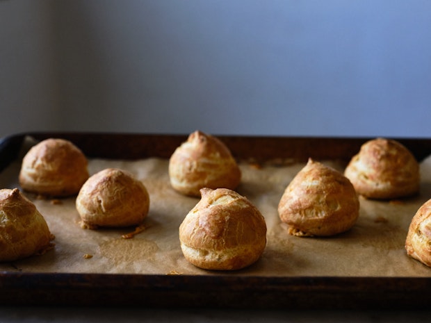 Gougeres piled high on a small plate