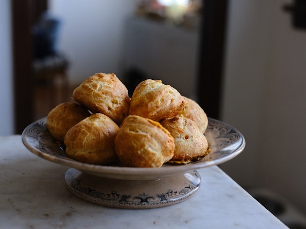 Gougeres on a parchment lined baking sheet