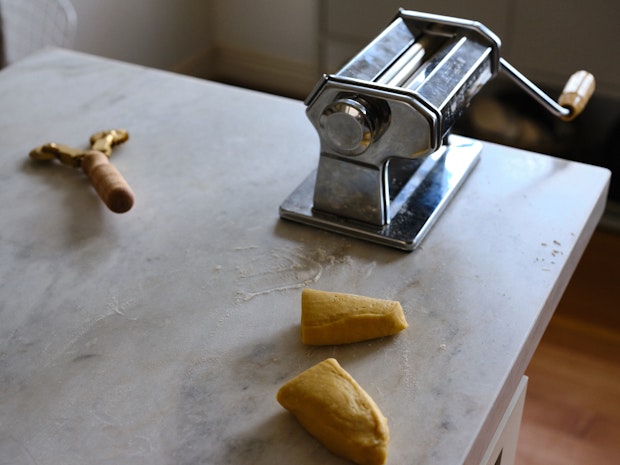 Pappardelle pasta next to the Atlas Pasta machine