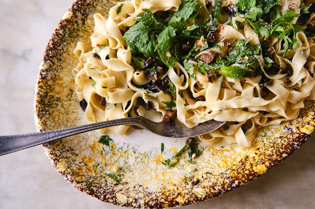 tagliatelle pasta tossed with herbs, butter, roasted mushrooms, Parmesan and citrus