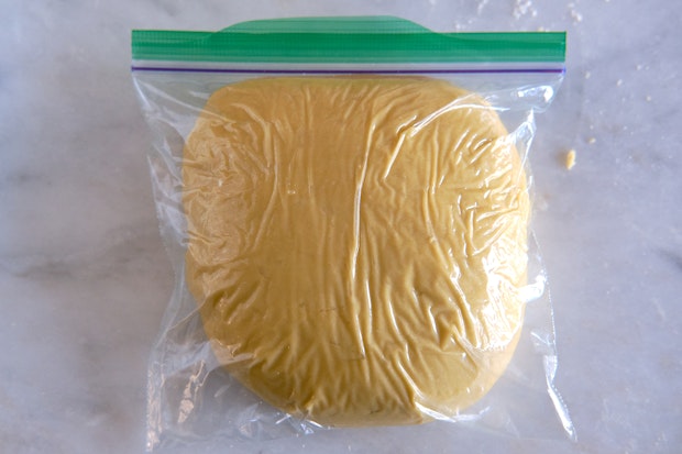 pasta dough resting in a plastic bag