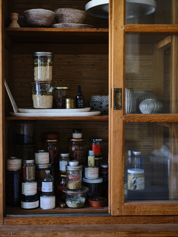Italian Barley Soup in a Jar in a Wood Cabinet with other Ingredients