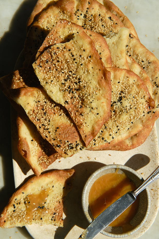 Crispy piadina flatbreads on a plate with honey