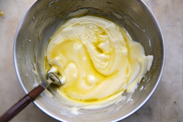 Icing being mixed in a bowl