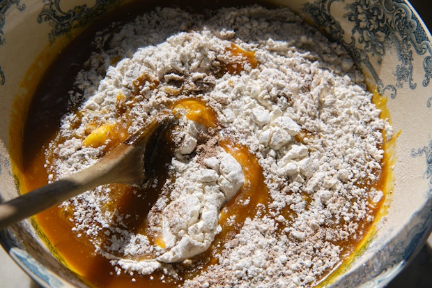 Flour and other ingredients being mixed in a bowl