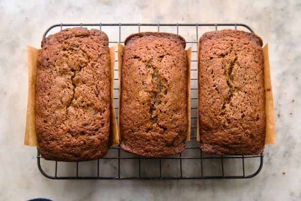 A trio of pumpkin breads cooling after baking