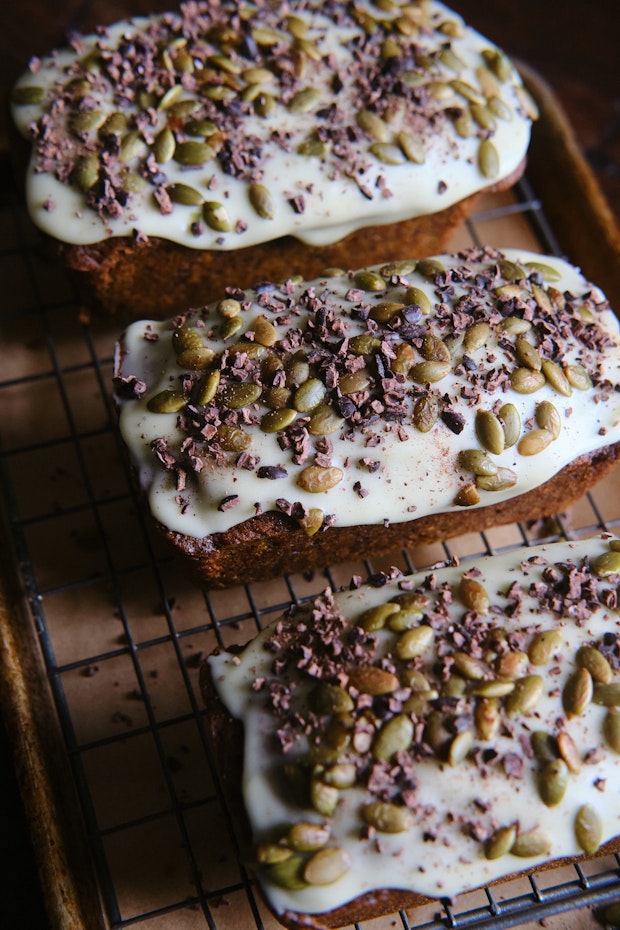 Pumpkin bread on a cooling rack with icing