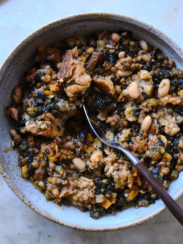 Ribollita, a beautifully thick Tuscan stew with dark greens, lots of beans, vegetables, olive oil, and thickened with day-old bread