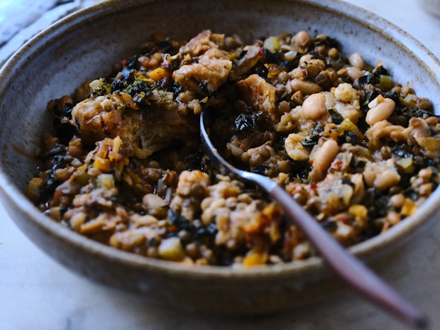 Ribollita, a beautifully thick Tuscan stew with dark greens, lots of beans, vegetables, olive oil, and thickened with day-old bread