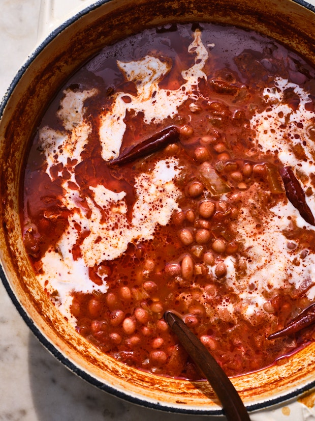 A White Pot of Slow-Cooked Beans made with Chiles and Coconut