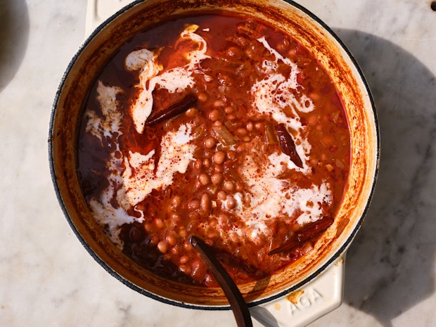 A White Pot of Slow-Cooked Beans made with Chiles and Coconut