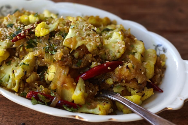 spicy cauliflower served in a white dish