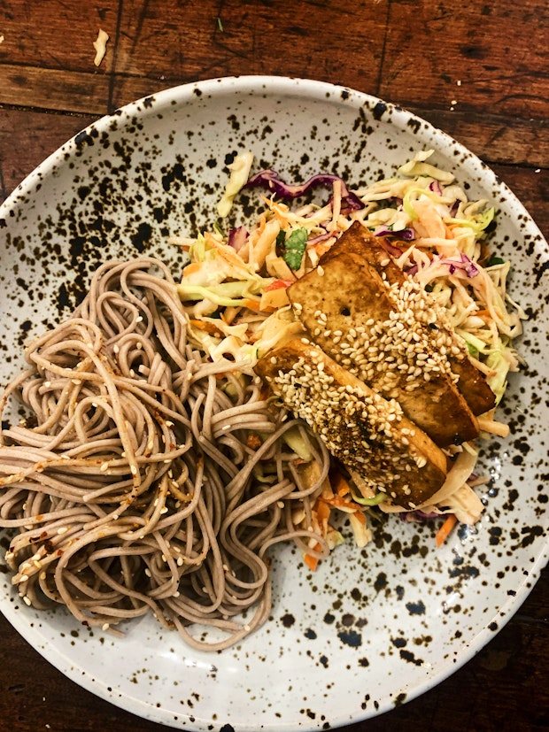 Vegan Fish Tacos with Spicy Sesame Slaw on a Speckled Plate