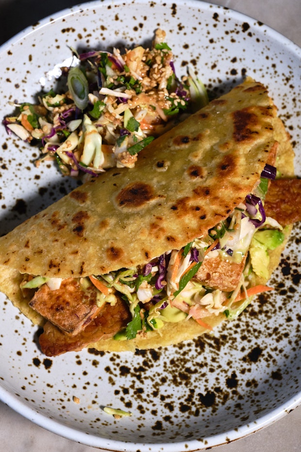 Vegan Fish Tacos with Spicy Sesame Slaw on a Speckled Plate