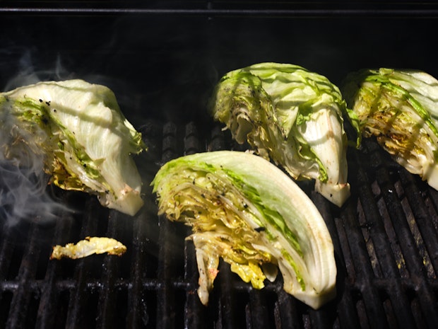 Wedge lettuce cut into quarters, ready to serve