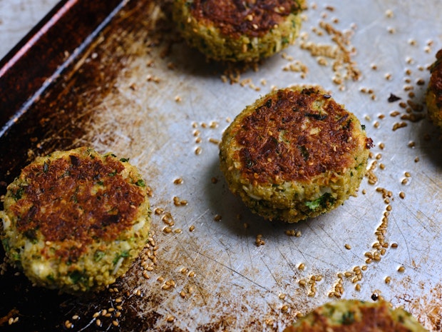 Quinoa patties on a baking sheet after baking