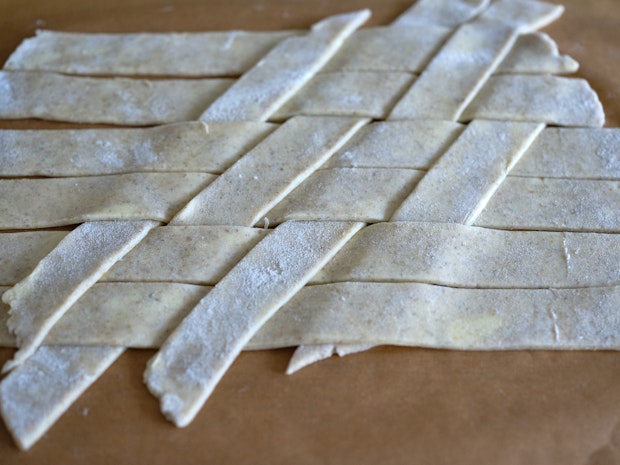 complete lattice pie crust top ready to be placed on pie before baking