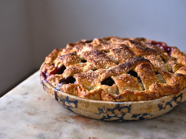 berry pie with a lattice top in a pie plate