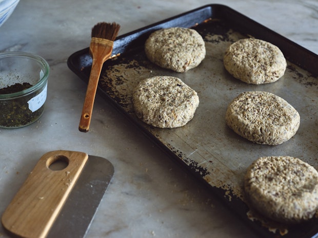 Individual rolls shaped and arranged on metal baking sheet prior to baking