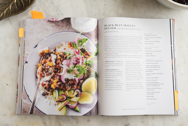Melissa Clark's book Dinner: Changing The Game on a marble counter open to a recipe page