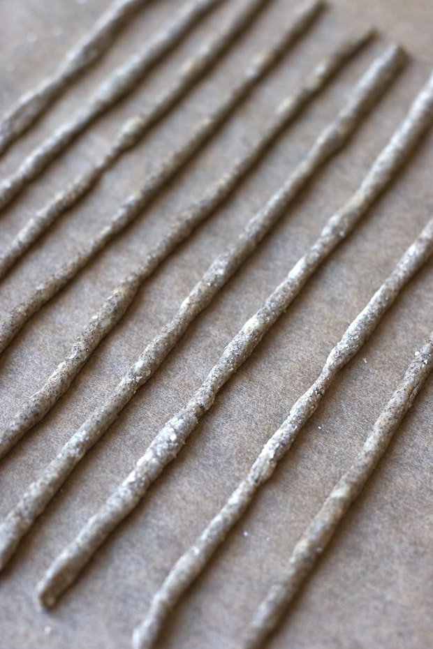 dough for cheese straws formed into straw shape