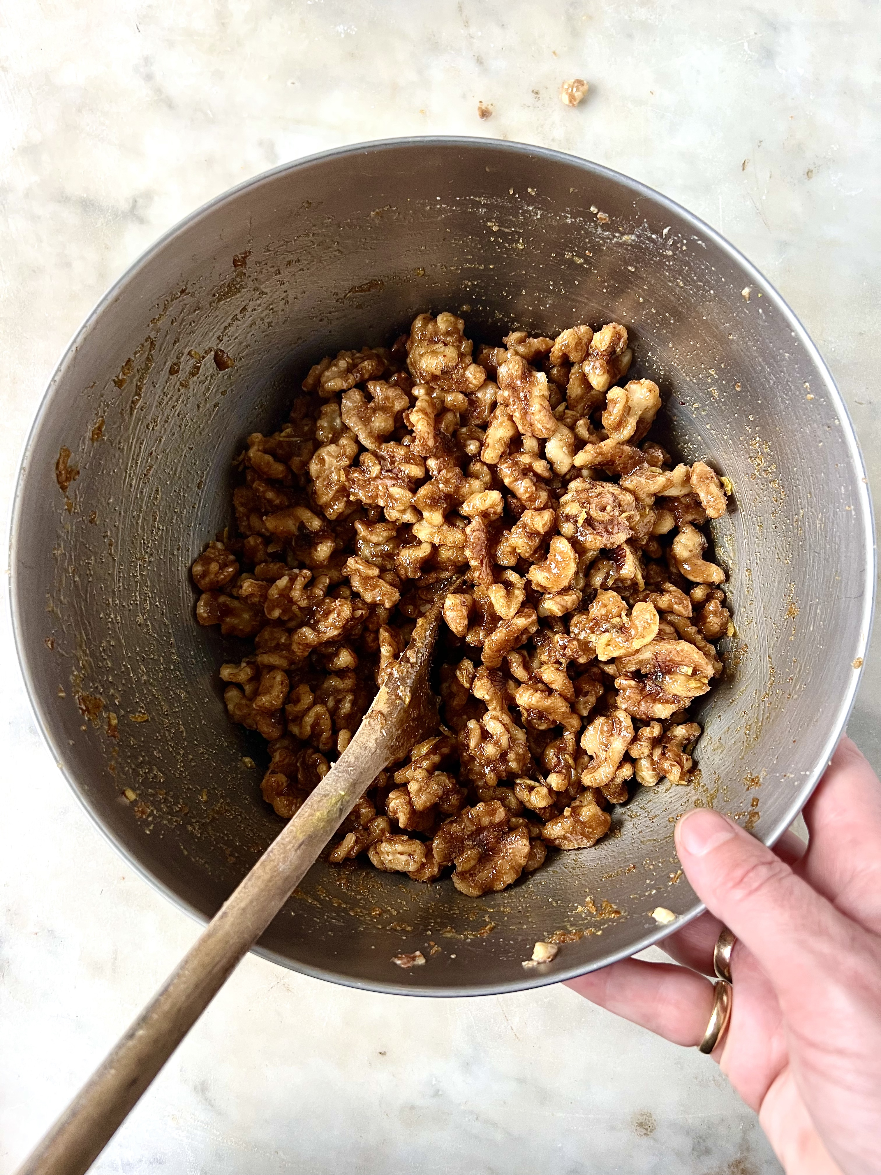 Walnuts in a bowl toasted with brown sugar mixture