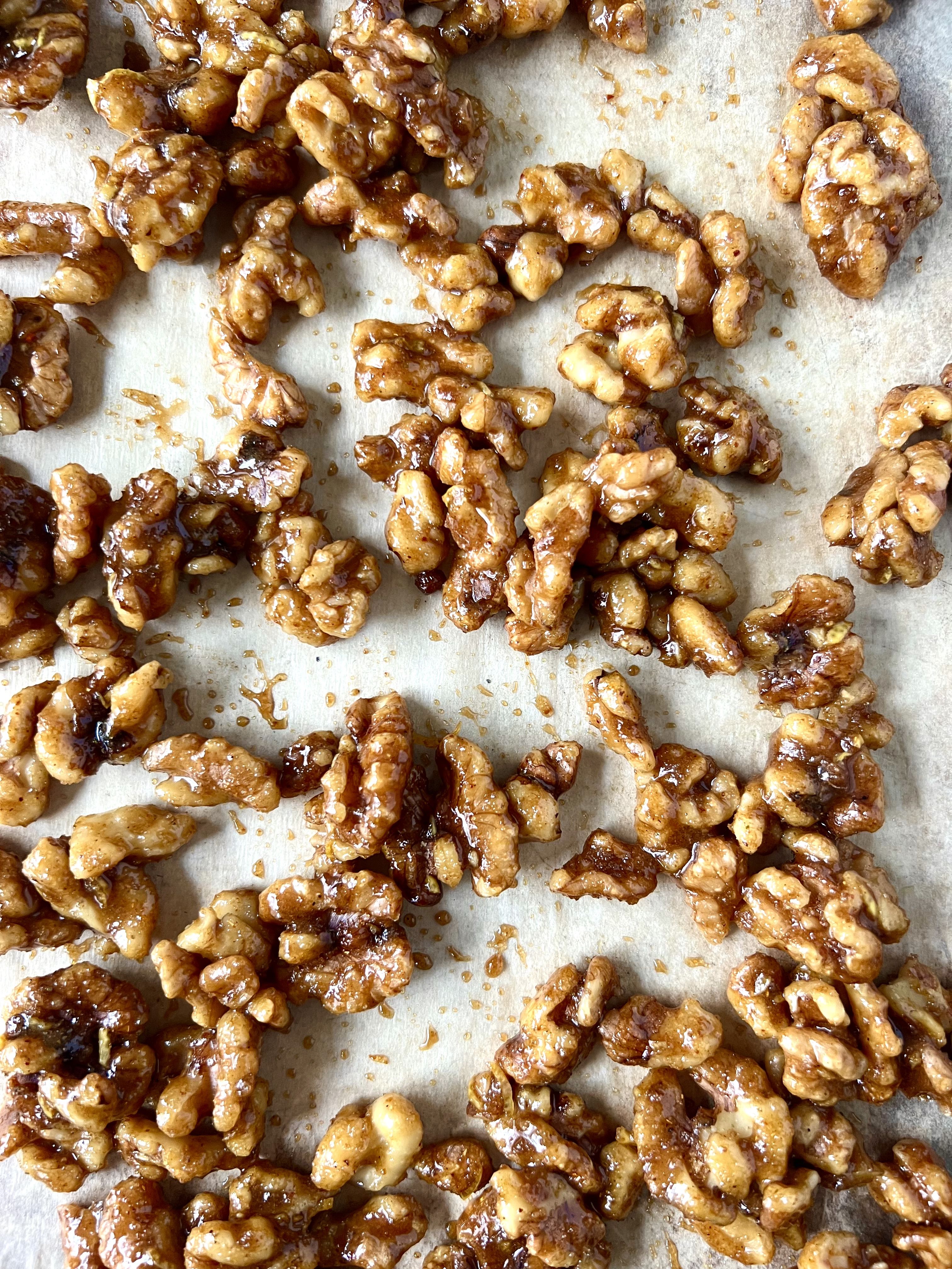 Walnuts coated with sugar mixture before baking