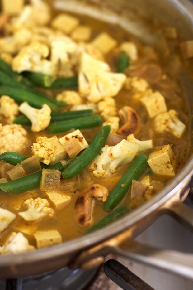 cashew curry in a skillet before serving