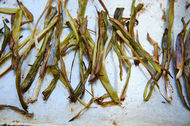 scallions roasted on a baking sheet