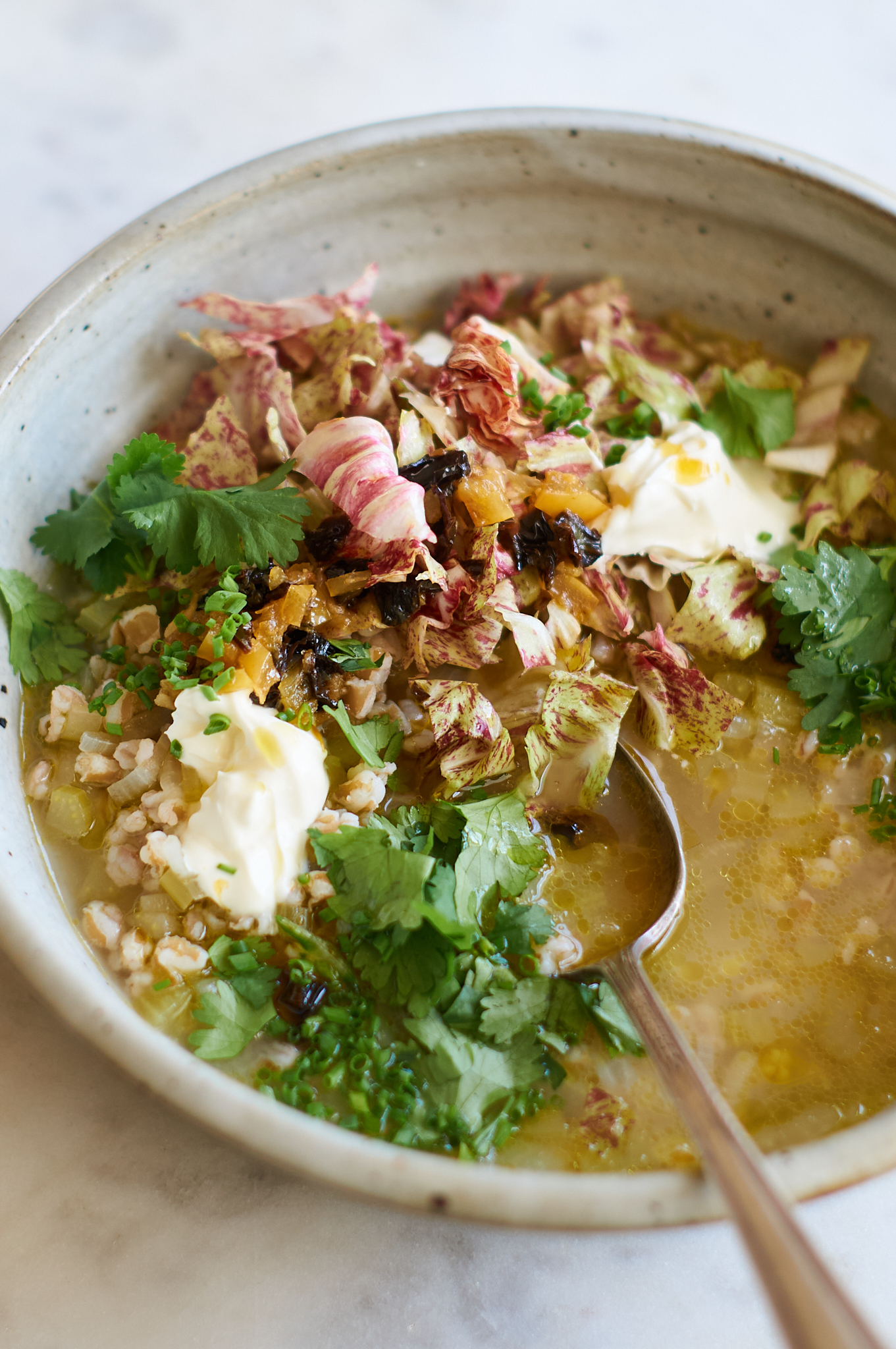 Chicory Soup  in a bowl with lots of toppings