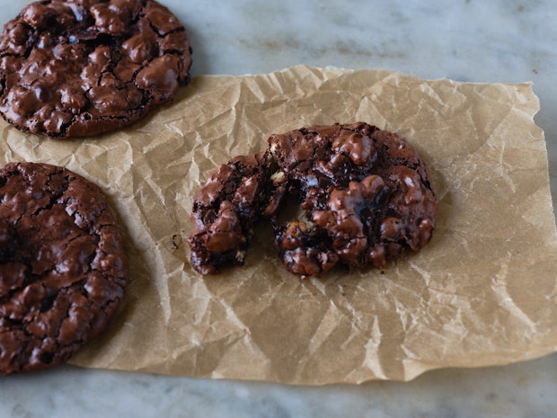 chocolate cookie on parchment paper after baking