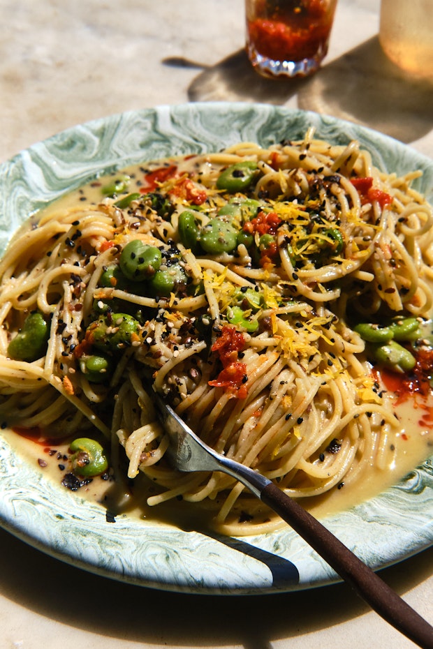 citron noodles with furikake and chili crisp on a plate