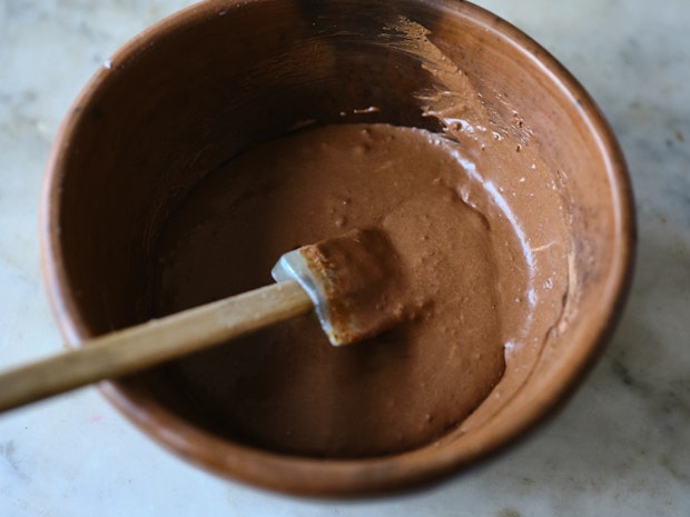 ingredients for chocolate pudding mixed together in a bowl