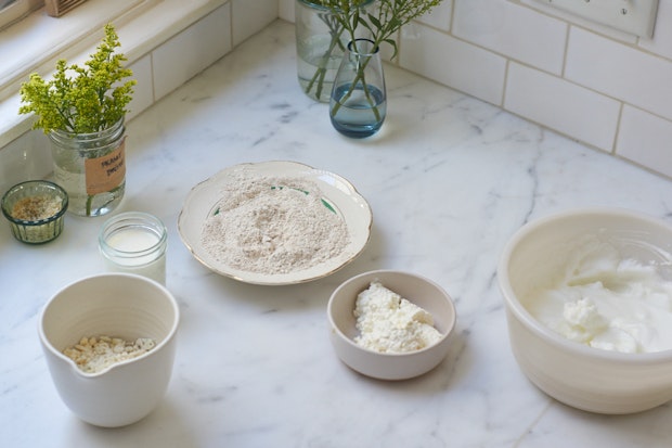 ingredients for cottage cheese pancakes arranged on marble counter