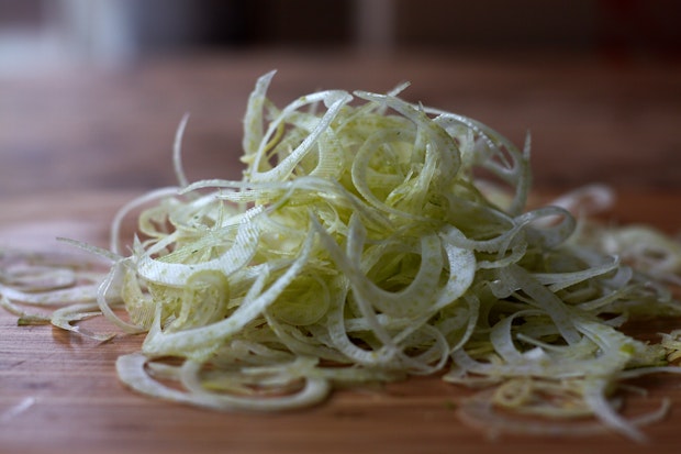 close up photo of fennel that has been shaved on a mandoline