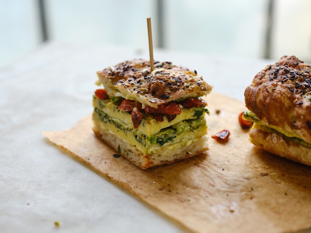 side view of sheet pan frittata sandwich help together with toothpick