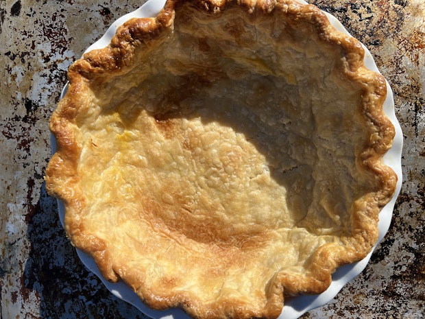 a fully baked pie crust prior to filling