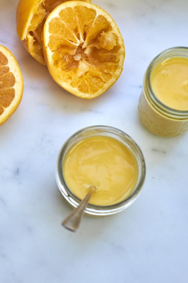 grapefruit curd in a glass jar on a counter