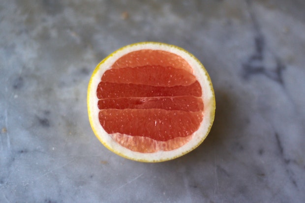 one half of a pink grapefruit
