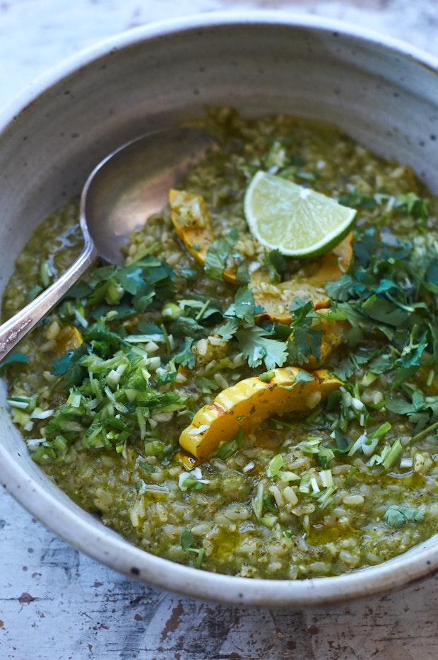 a bowl of rice-based green curry porridge made with delicata squash and herbs